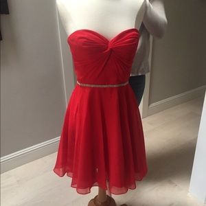 Above the knee homecoming dress by Faviana size 4